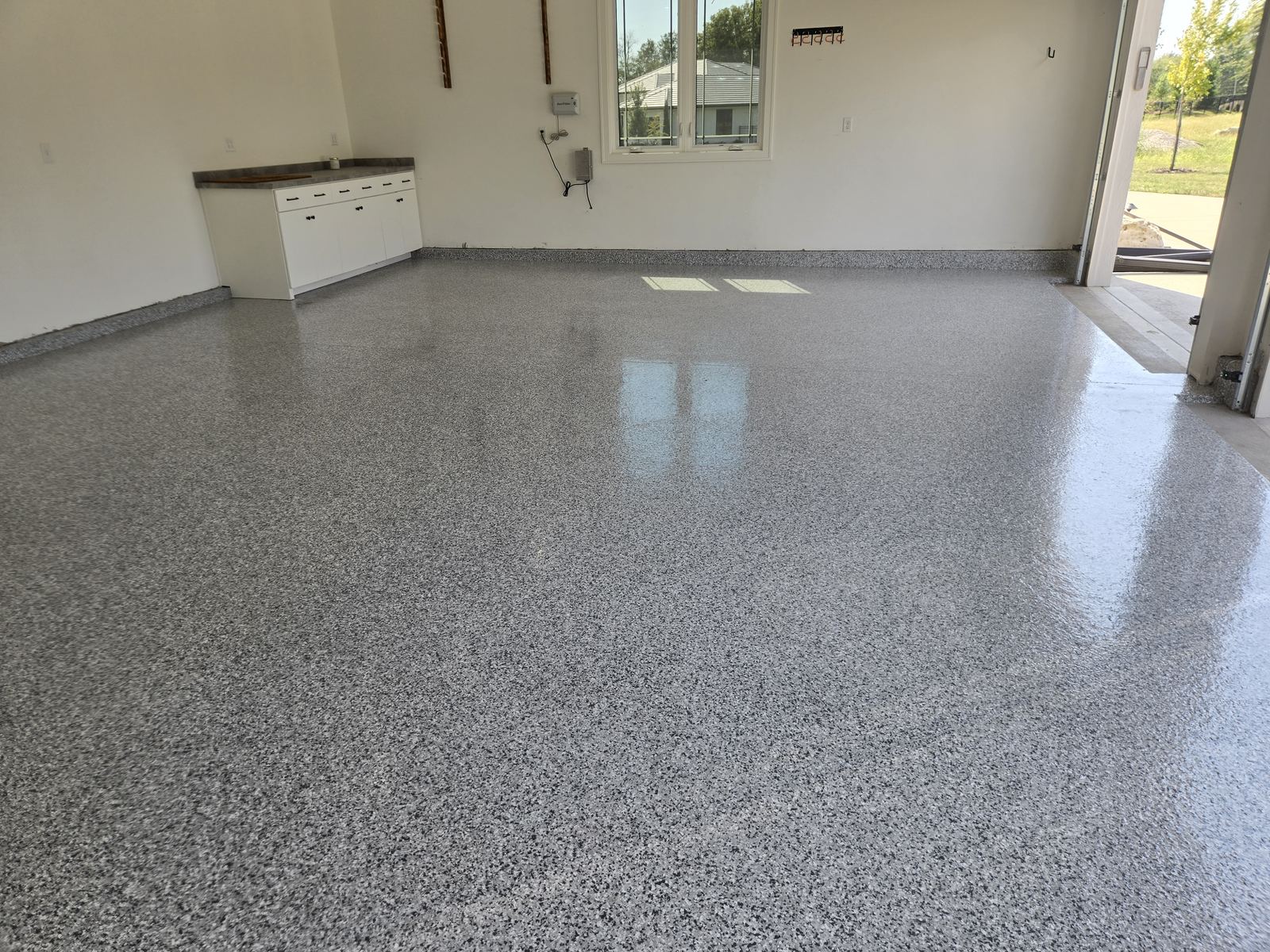 Finished flake epoxy garage floor by Alex Foundation Repair
